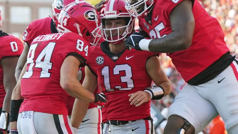 Georgia Bulldogs quarterback Stetson Bennett (13) celebrates his touchdown run as Georgia takes on Auburn at Sanford Stadium in Athens, Ga. on Saturday, Oct. 8th, 2022.

Sports Richard Hamm