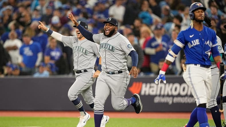 Oct 8, 2022; Toronto, Ontario, CAN; Seattle Mariners relief pitcher Diego Castillo (63) celebrates after the game against the Toronto Blue Jays in game two of the Wild Card series for the 2022 MLB Playoffs at Rogers Centre. Mandatory Credit: John E. Sokolowski-USA TODAY Sports