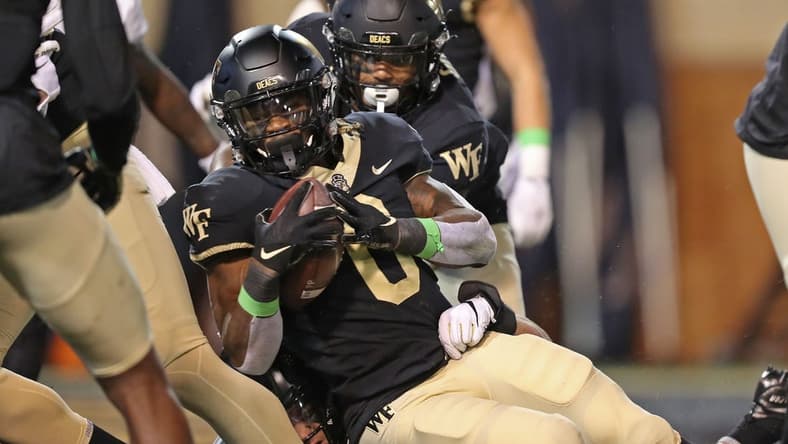 Oct 8, 2022; Winston-Salem, North Carolina, USA; Wake Forest Demon Deacons running back Christian Turner (0) crosses the goal line for a touchdown against the Army Black Knights during the first half at Truist Field. Mandatory Credit: Danny Wild-USA TODAY Sports