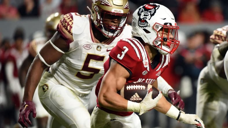 Oct 8, 2022; Raleigh, North Carolina, USA;North Carolina State Wolfpack running back Jordan Houston (3) runs the ball during the first half against the Florida State Seminoles at Carter-Finley Stadium. Mandatory Credit: Rob Kinnan-USA TODAY Sports