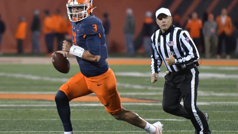 Oct 8, 2022; Champaign, Illinois, USA;  Illinois Fighting Illini quarterback Tommy DeVito (3) runs with the ball during the first half against the Iowa Hawkeyes at Memorial Stadium. Mandatory Credit: Ron Johnson-USA TODAY Sports