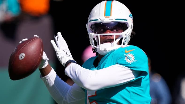 Oct 9, 2022; East Rutherford, New Jersey, USA; Miami Dolphins quarterback Teddy Bridgewater (5) warms up before the game against the New York Jets at MetLife Stadium. Mandatory Credit: Robert Deutsch-USA TODAY Sports