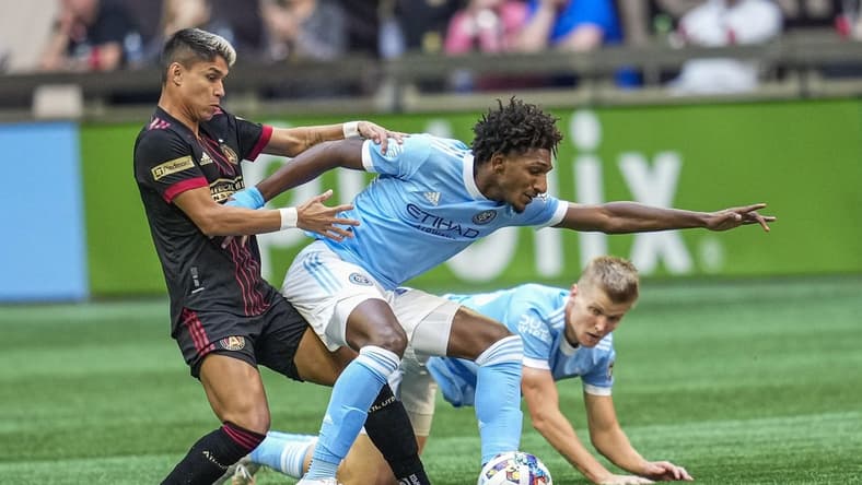 Oct 9, 2022; Atlanta, Georgia, USA; Atlanta United midfielder Luiz Araujo (19) and New York City FC forward Talles Magno (43) battle for the ball in the first half at Mercedes-Benz Stadium. Mandatory Credit: Dale Zanine-USA TODAY Sports