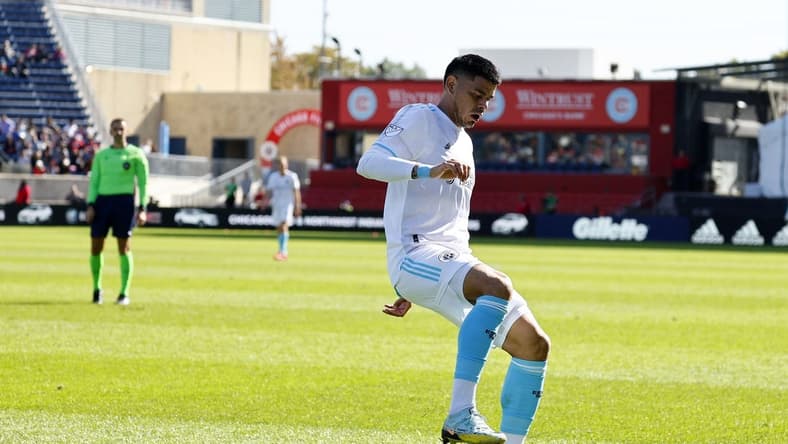 Oct 9, 2022; Chicago, Illinois, USA; New England Revolution forward Gustavo Bou (7) kicks the ball against the Chicago Fire during the first half at Bridgeview Stadium. Mandatory Credit: Mike Dinovo-USA TODAY Sports