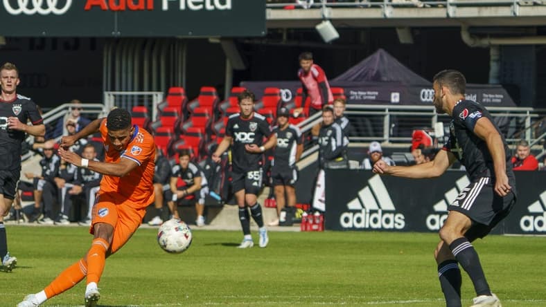 Oct 9, 2022; Washington, District of Columbia, USA; FC Cincinnati forward Brenner (9) shoots and scores a goal against D.C. United during the first half for their fourth goal of the game at Audi Field. Mandatory Credit: Tony Quinn-USA TODAY Sports
