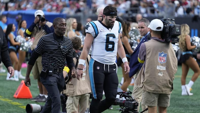 Oct 9, 2022; Charlotte, North Carolina, USA; Carolina Panthers quarterback Baker Mayfield (6) makes his way to the locker room before the final seconds of the end of the second quarter against the San Francisco 49ers at Bank of America Stadium. Mandatory Credit: Jim Dedmon-USA TODAY Sports
