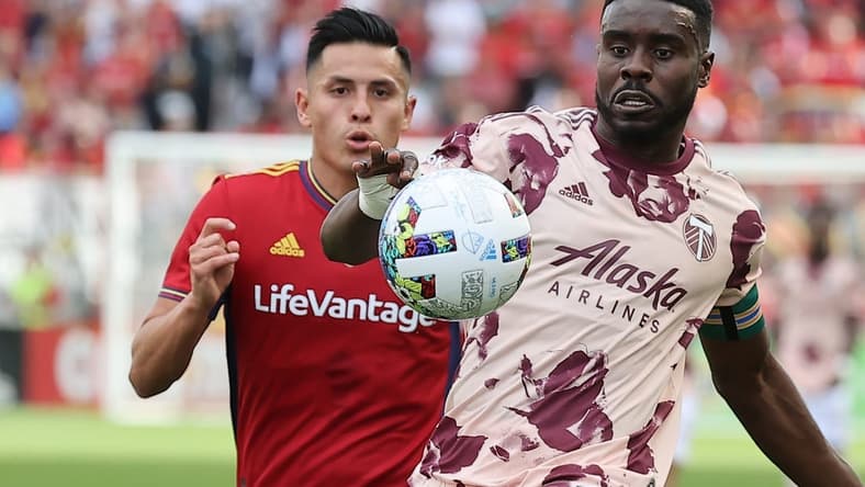 Oct 9, 2022; Sandy, Utah, USA;  Real Salt Lake forward Rubio Rubin (14) and Portland Timbers defender Larrys Mabiala (33) play for a ball in the first half at America First Field. Mandatory Credit: Rob Gray-USA TODAY Sports