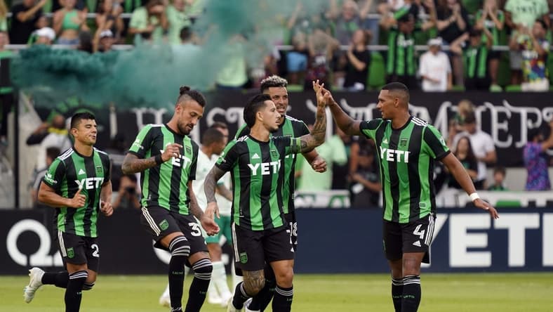Oct 9, 2022; Austin, Texas, USA; Austin FC forward Sebasti  n Driussi (7) celebrates scoring a goal with teammates during the second half against the Colorado Rapids at Q2 Stadium. Mandatory Credit: Scott Wachter-USA TODAY Sports