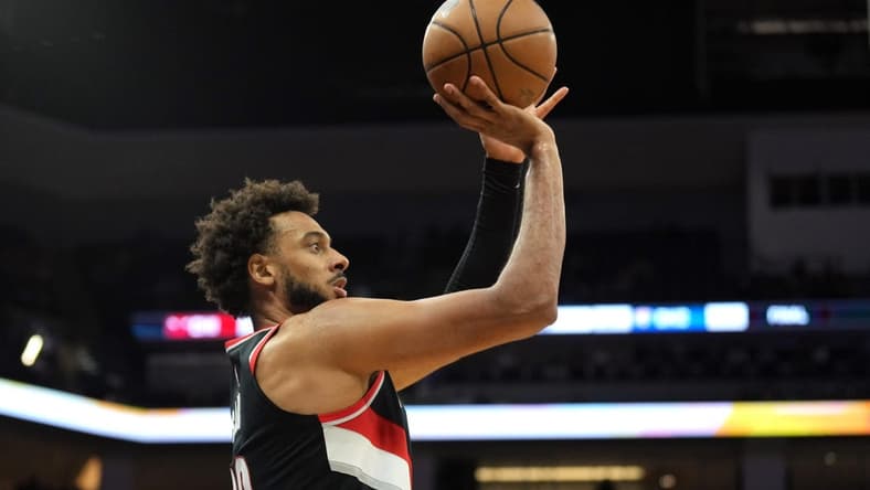 Oct 9, 2022; Sacramento, California, USA; Portland Trail Blazers center Olivier Sarr (33) shoots a 3-point basket against the Sacramento Kings during the second quarter at Golden 1 Center. Mandatory Credit: Darren Yamashita-USA TODAY Sports