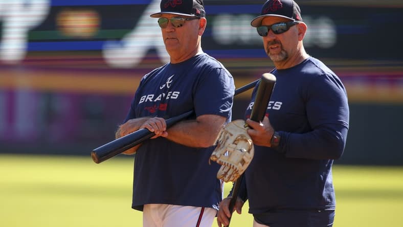 Oct 10, 2022; Atlanta, Georgia, USA; Atlanta Braves manager Brian Snitker (43) and bench coach Walt Weiss (4) during a team workout for the NLDS at Truist Park. Mandatory Credit: Brett Davis-USA TODAY Sports