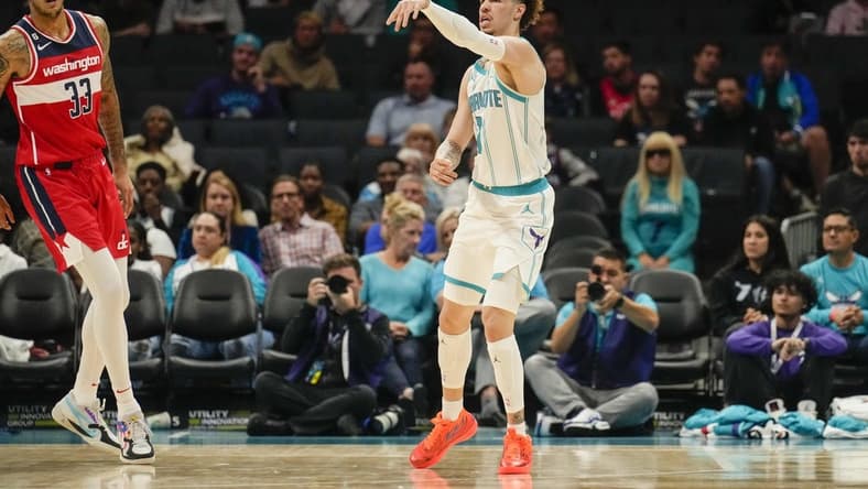 Oct 10, 2022; Charlotte, North Carolina, USA; Charlotte Hornets guard LaMelo Ball (1) passes cross court against the Washington Wizards during the first quarter at Spectrum Center. Mandatory Credit: Jim Dedmon-USA TODAY Sports