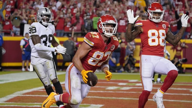 Oct 10, 2022; Kansas City, Missouri, USA; Kansas City Chiefs tight end Travis Kelce (87) catches a passes for a touch down against the Las Vegas Raiders in the second half at GEHA Field at Arrowhead Stadium. Mandatory Credit: Denny Medley-USA TODAY Sports
