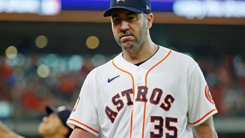 Oct 11, 2022; Houston, Texas, USA; Houston Astros starting pitcher Justin Verlander (35) reacts as he walks off the field against the Seattle Mariners at the end of third inning in game one of the ALDS for the 2022 MLB Playoffs at Minute Maid Park. Mandatory Credit: Troy Taormina-USA TODAY Sports