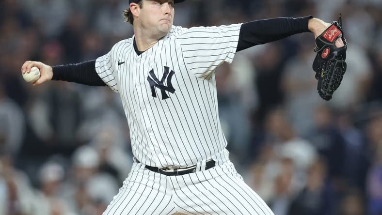 Oct 11, 2022; Bronx, New York, USA; New York Yankees starting pitcher Gerrit Cole (45) throws a pitch during the first inning in game one of the ALDS against the Cleveland Guardians for the 2022 MLB Playoffs at Yankee Stadium. Mandatory Credit: Brad Penner-USA TODAY Sports
