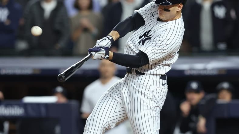 Oct 11, 2022; Bronx, New York, USA;   New York Yankees first baseman Anthony Rizzo (48) hits a home run during the sixth inning against the Cleveland Guardians iin game one of the ALDS for the 2022 MLB Playoffs at Yankee Stadium. Mandatory Credit: Brad Penner-USA TODAY Sports