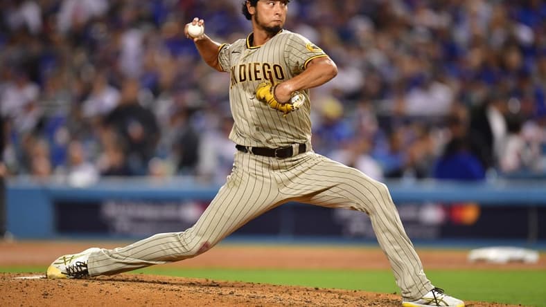 Oct 12, 2022; Los Angeles, California, USA;San Diego Padres starting pitcher Yu Darvish (11) throws during the sixth inning of game two of the NLDS for the 2022 MLB Playoffs against the Los Angeles Dodgers at Dodger Stadium. Mandatory Credit: Gary A. Vasquez-USA TODAY Sports