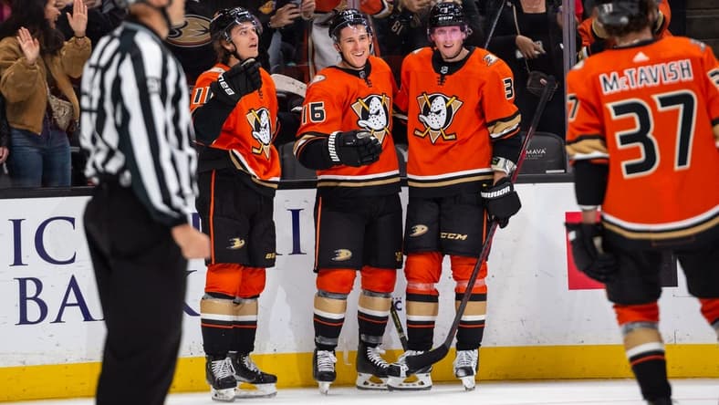 Oct 12, 2022; Anaheim, California, USA; Anaheim Ducks center Trevor Zegras (11) and center Ryan Strome (16) and defenseman John Klingberg (3) celebrate after scoring against Seattle Kraken during the second period at Honda Center. Mandatory Credit: Jonathan Hui-USA TODAY Sports