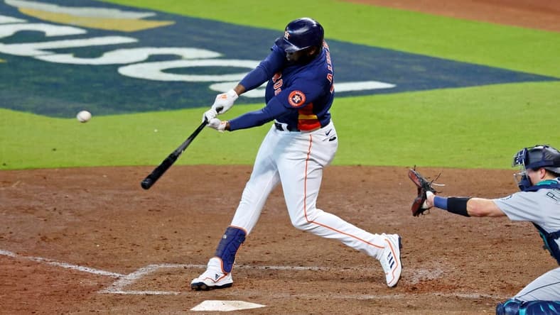 Oct 13, 2022; Houston, Texas, USA; Houston Astros left fielder Yordan Alvarez (44) hits a two-run home run against the Seattle Mariners during the sixth inning of game two of the ALDS for the 2022 MLB Playoffs at Minute Maid Park. Mandatory Credit: Thomas Shea-USA TODAY Sports
