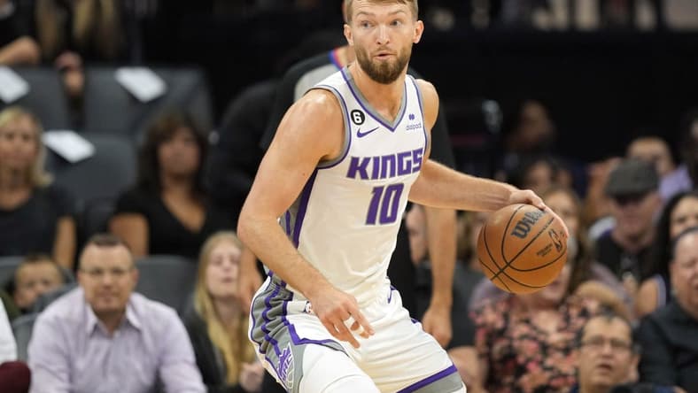 Oct 9, 2022; Sacramento, California, USA; Sacramento Kings forward Domantas Sabonis (10) dribbles against the Portland Trail Blazers during the first quarter at Golden 1 Center. Mandatory Credit: Darren Yamashita-USA TODAY Sports