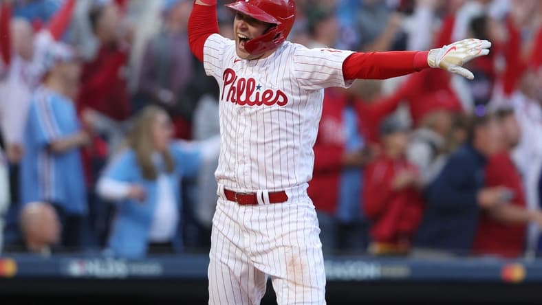 Oct 14, 2022; Philadelphia, Pennsylvania, USA; Philadelphia Phillies first baseman Rhys Hoskins celebrates after hitting a three-run home run against the Atlanta Braves during the 3rd inning in game three of the NLDS for the 2022 MLB Playoffs at Citizens Bank Park. Mandatory Credit: Bill Streicher-USA TODAY Sports