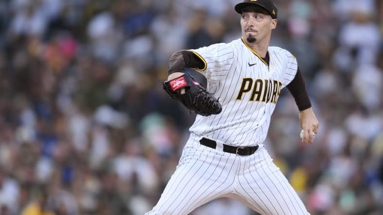 Oct 14, 2022; San Diego, California, USA; San Diego Padres starting pitcher Blake Snell (4) throws a pitch in the first inning against the Los Angeles Dodgers during game three of the NLDS for the 2022 MLB Playoffs at Petco Park. Mandatory Credit: Orlando Ramirez-USA TODAY Sports