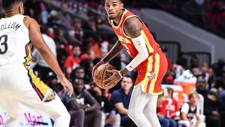 Oct 14, 2022; Birmingham, Alabama, USA; Atlanta Hawks guard Dejounte Murray (5) prepares to drive on New Orleans Pelicans guard CJ McCollum (3) in the first quarter at Legacy Arena at BJCC. Mandatory Credit: Larry Robinson-USA TODAY Sports