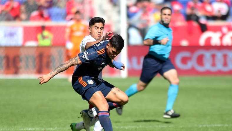 Oct 15, 2022; Harrison, New Jersey, USA;  FC Cincinnati forward Brandon Vazquez (19) battles New York Red Bulls midfielder Frankie Amaya (8) for the ball during the second half at Red Bull Arena. Mandatory Credit: Wendell Cruz-USA TODAY Sports