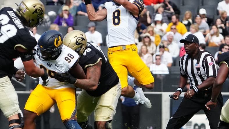 Oct 15, 2022; Boulder, Colorado, USA; California Golden Bears linebacker Jackson Sirmon (8) pulls in an interception in the first quarter against the Colorado Buffaloes at Folsom Field. Mandatory Credit: Ron Chenoy-USA TODAY Sports