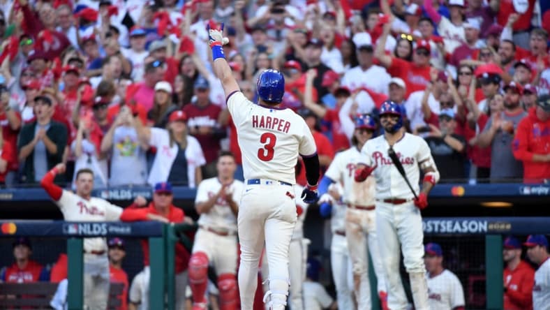 Oct 15, 2022; Philadelphia, Pennsylvania, USA; Philadelphia Phillies designated hitter Bryce Harper (3) gestures after hitting a home run in the eight inning against the Atlanta Braves in game four of the NLDS for the 2022 MLB Playoffs at Citizens Bank Park. Mandatory Credit: Eric Hartline-USA TODAY Sports