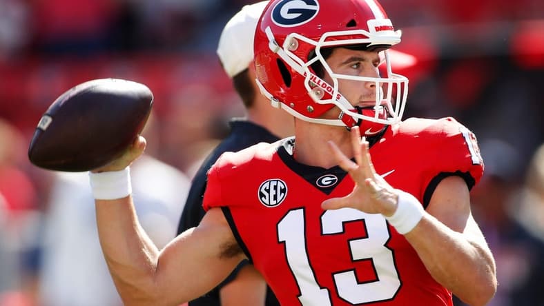 Georgia quarterback Stetson Bennett (13) warms up before the start of a NCAA college football game between Vanderbilt and Georgia in Athens, Ga., on Saturday, Oct. 15, 2022.

News Joshua L Jones