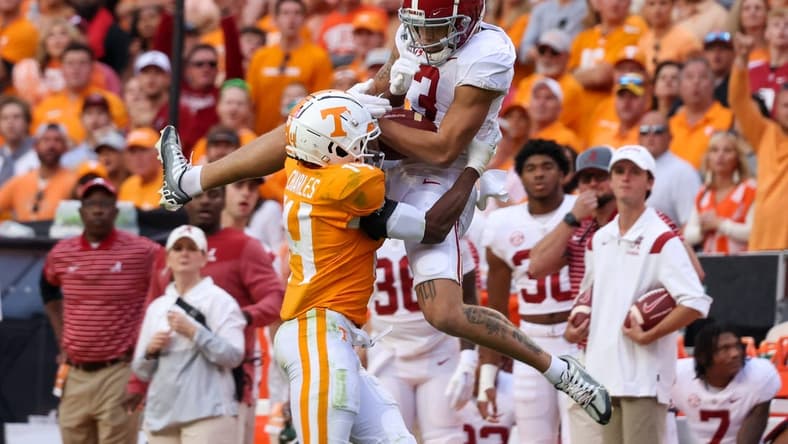 Oct 15, 2022; Knoxville, Tennessee, USA; Alabama Crimson Tide wide receiver Jermaine Burton (3) catches a pass against Tennessee Volunteers defensive back Christian Charles (14) during the second half at Neyland Stadium. Mandatory Credit: Randy Sartin-USA TODAY Sports