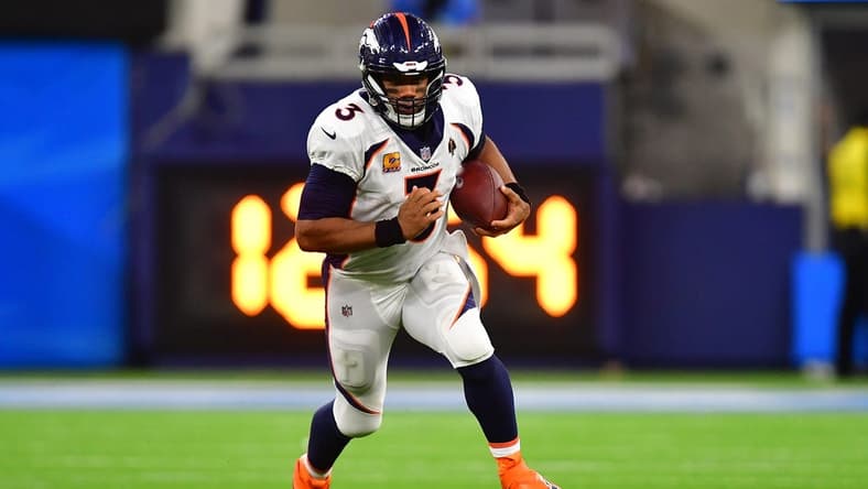 Oct 17, 2022; Inglewood, California, USA; Denver Broncos quarterback Russell Wilson (3) runs the ball against the Los Angeles Chargers during the second half at SoFi Stadium. Mandatory Credit: Gary A. Vasquez-USA TODAY Sports