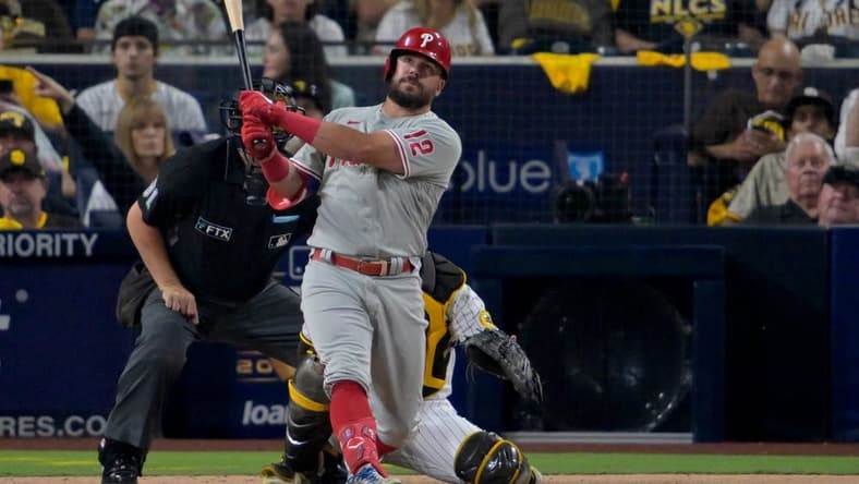 Oct 18, 2022; San Diego, California, USA; Philadelphia Phillies left fielder Kyle Schwarber (12) hits a home run during the sixth inning of game one of the NLCS for the 2022 MLB Playoffs against the San Diego Padres at Petco Park. Mandatory Credit: Jayne Kamin-Oncea-USA TODAY Sports