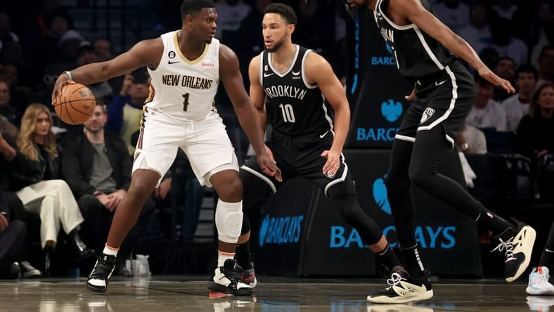 Oct 19, 2022; Brooklyn, New York, USA; New Orleans Pelicans forward Zion Williamson (1) controls the ball against Brooklyn Nets guard Ben Simmons (10) and forward Kevin Durant (7) during the first quarter at Barclays Center. Mandatory Credit: Brad Penner-USA TODAY Sports