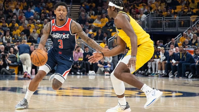Oct 19, 2022; Indianapolis, Indiana, USA; Washington Wizards guard Bradley Beal (3) dribbles the ball while Indiana Pacers forward Terry Taylor (21) defends in the second quarter at Gainbridge Fieldhouse. Mandatory Credit: Trevor Ruszkowski-USA TODAY Sports