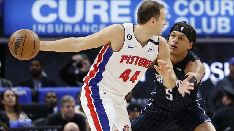 Oct 19, 2022; Detroit, Michigan, USA;  Detroit Pistons forward Bojan Bogdanovic (44) is defended by Orlando Magic forward Paolo Banchero (5) in the first half at Little Caesars Arena. Mandatory Credit: Rick Osentoski-USA TODAY Sports