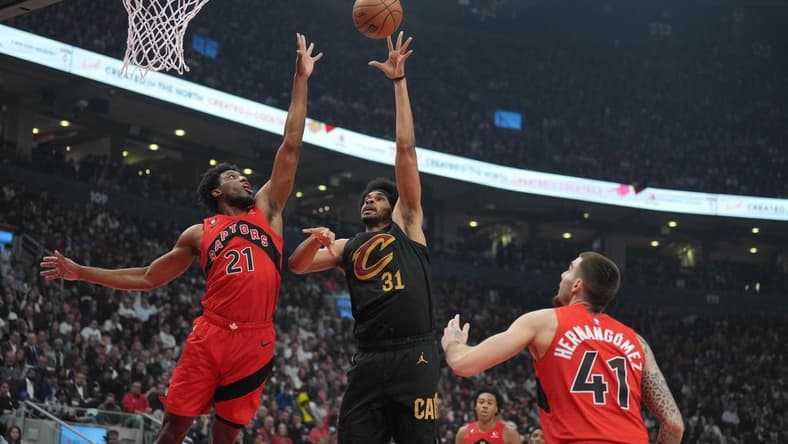 Oct 19, 2022; Toronto, Ontario, CAN; Cleveland Cavaliers center Jarrett Allen (31) drives to the basket as Toronto Raptors forward Thaddeus Young (21) tries to defend during the second quarter at Scotiabank Arena. Mandatory Credit: Nick Turchiaro-USA TODAY Sports