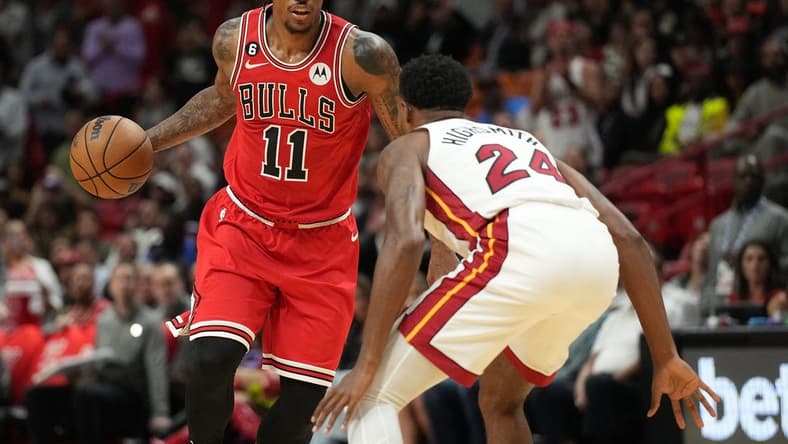 Oct 19, 2022; Miami, Florida, USA; Chicago Bulls forward DeMar DeRozan (11) brings the ball up the court as Miami Heat forward Haywood Highsmith (24) defends in the first half at FTX Arena. Mandatory Credit: Jim Rassol-USA TODAY Sports