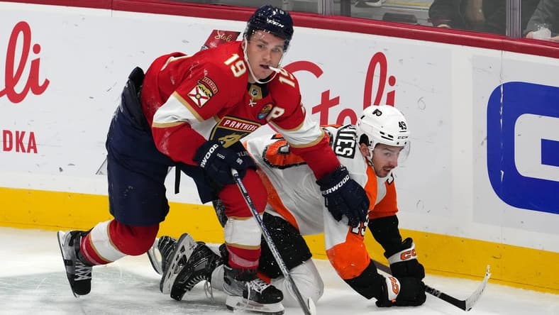 Oct 19, 2022; Sunrise, Florida, USA; Florida Panthers left wing Matthew Tkachuk (19) checks Philadelphia Flyers left wing Noah Cates (49) to the ice during the third period at FLA Live Arena. Mandatory Credit: Jasen Vinlove-USA TODAY Sports