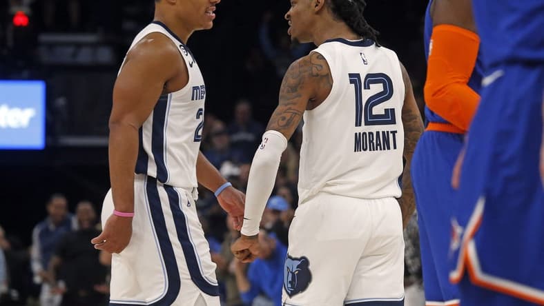 Oct 19, 2022; Memphis, Tennessee, USA; Memphis Grizzlies guard Desmond Bane (22) and guard Ja Morant (12) react after a basket during the second half against the New York Knicks at FedExForum. Mandatory Credit: Petre Thomas-USA TODAY Sports