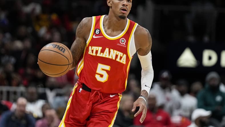 Oct 19, 2022; Atlanta, Georgia, USA; Atlanta Hawks guard Dejounte Murray (5) dribbles the ball against the Houston Rockets during the second half at State Farm Arena. Mandatory Credit: Dale Zanine-USA TODAY Sports