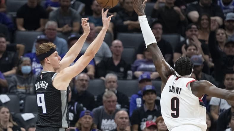 October 19, 2022; Sacramento, California, USA; Sacramento Kings guard Kevin Huerter (9) shoots the basketball against Portland Trail Blazers forward Jerami Grant (9) during the second quarter at Golden 1 Center. Mandatory Credit: Kyle Terada-USA TODAY Sports