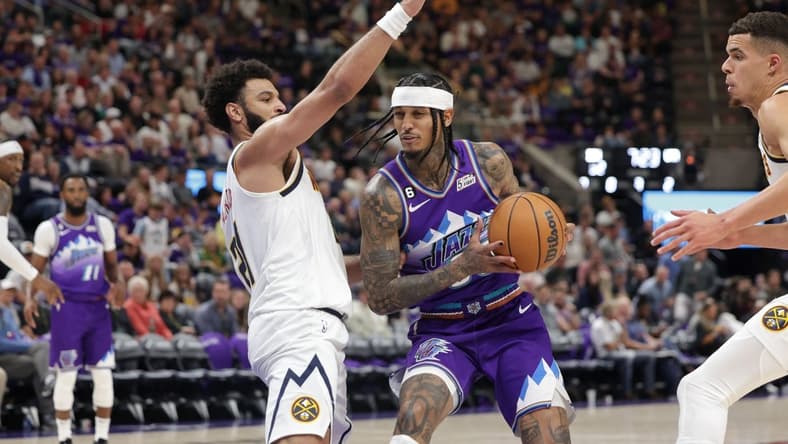 Oct 19, 2022; Salt Lake City, Utah, USA; Utah Jazz guard Jordan Clarkson (00) tries to get past Denver Nuggets guard Jamal Murray (27) during the second half at Vivint Arena. Mandatory Credit: Chris Nicoll-USA TODAY Sports