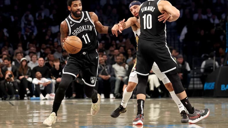 Oct 19, 2022; Brooklyn, New York, USA; Brooklyn Nets guard Ben Simmons (10) sets a pick for guard Kyrie Irving (11) against New Orleans Pelicans guard Jose Alvarado (15) during the first quarter at Barclays Center. Mandatory Credit: Brad Penner-USA TODAY Sports