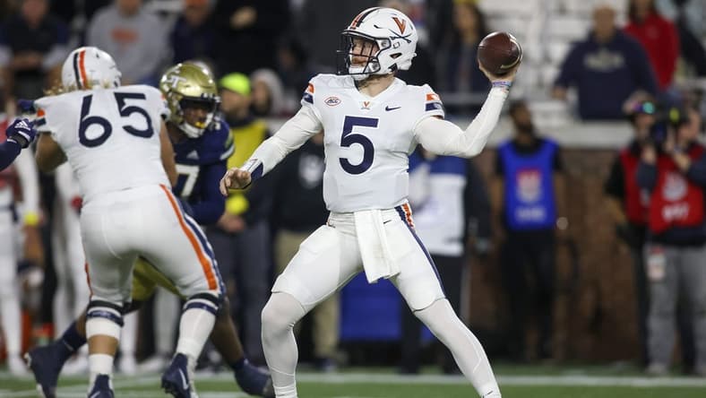 Oct 20, 2022; Atlanta, Georgia, USA; Virginia Cavaliers quarterback Brennan Armstrong (5) throws a pass against the Georgia Tech Yellow Jackets in the first half at Bobby Dodd Stadium. Mandatory Credit: Brett Davis-USA TODAY Sports