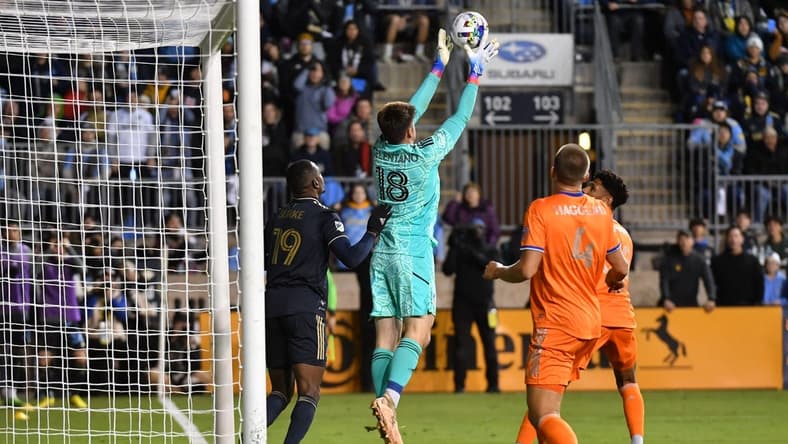 Oct 20, 2022; Philadelphia, Pennsylvania, US;  FC Cincinnati goalkeeper Roman Celentano (18) blocks a shot at the goal during the second half against the Philadelphia Union at Subaru Park. Mandatory Credit: Eric Hartline-USA TODAY Sports