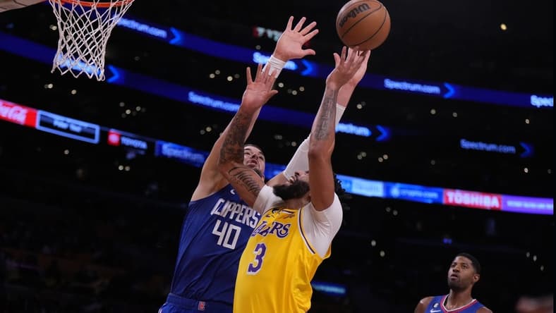 Oct 20, 2022; Los Angeles, California, USA; Los Angeles Lakers forward Anthony Davis (3) shoots the ball against LA Clippers center Ivica Zubac (40) in the first half at Crypto.com Arena. Mandatory Credit: Kirby Lee-USA TODAY Sports