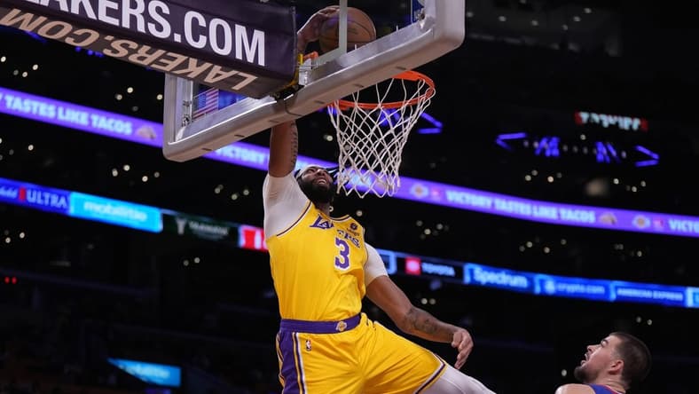 Oct 20, 2022; Los Angeles, California, USA; Los Angeles Lakers forward Anthony Davis (3) dunks the ball against LA Clippers in the first half at Crypto.com Arena. Mandatory Credit: Kirby Lee-USA TODAY Sports