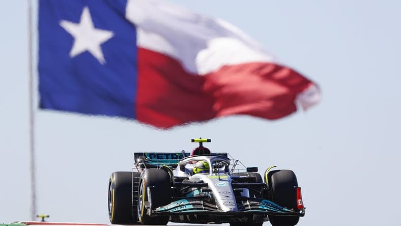 Oct 21, 2022; Austin, Texas, USA;  Mercedes-AMG Petronas driver Lewis Hamilton (44) passes the Texas flag during practice for the U.S. Grand Prix at Circuit of the Americas. Mandatory Credit: Erich Schlegel-USA TODAY Sports