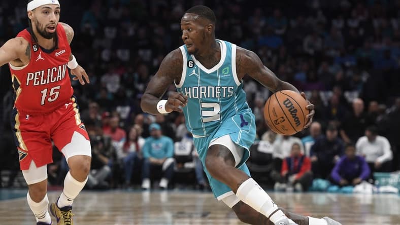 Oct 21, 2022; Charlotte, North Carolina, USA; Charlotte Hornets guard Terry Rozier (3) drives past New Orleans Pelicans guard Jose Alvarado (15) during the first half at the Spectrum Center. Mandatory Credit: Sam Sharpe-USA TODAY Sports